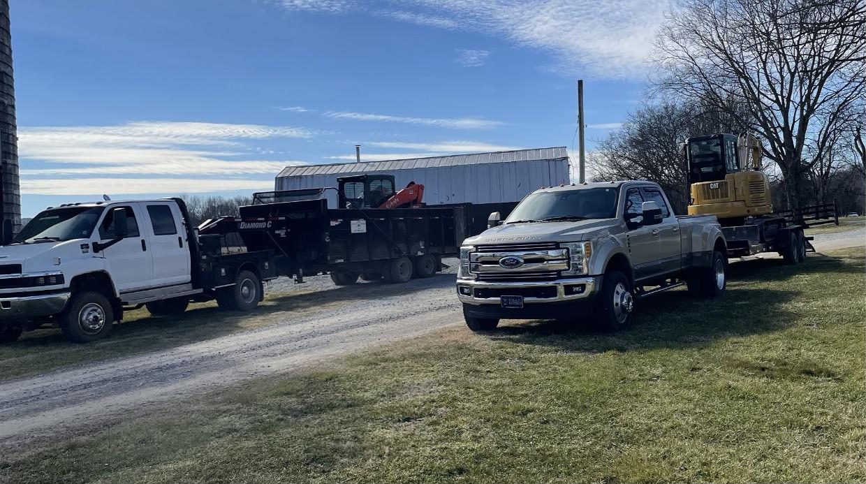 Chambers Construction trucks, dump trailer and excavator